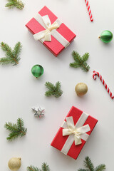 Fir branches, Christmas decorations and gift boxes on white background