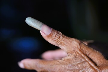 The old man's very long fingernails