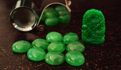 Real jade, green carved jade lay on the ground.