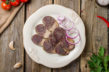 Sausage-Kazy made from horse meat on old wooden table top view