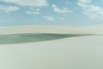 Fototapeta na wymiar Lagoon with dune in the horizon, Lençois Maranhenses, Brazil 