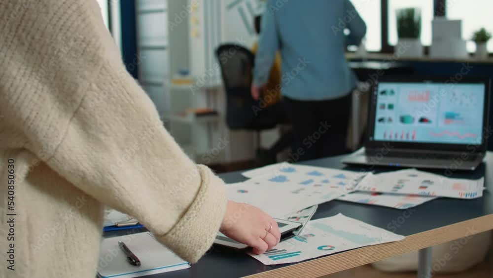 Poster selective focus on woman hands holding tablet zooming in on sales pie chart and comparing data with 