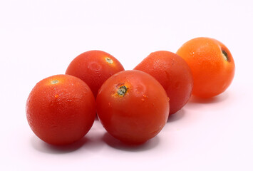 fresh red cherry tomatoes on white background