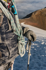 Fototapeta premium mountaineer with rope and frozen clothes