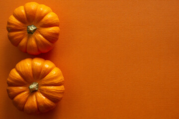 Halloween flat lays with orange backdrop