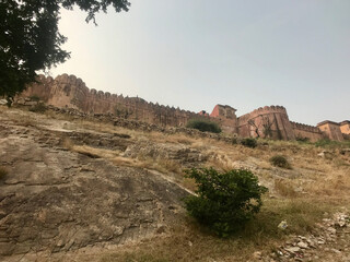 Jaipur, India, November 2019 - A train is on the side of a dirt field
