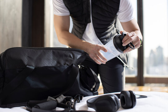Mid adult man getting ready to go out and workout