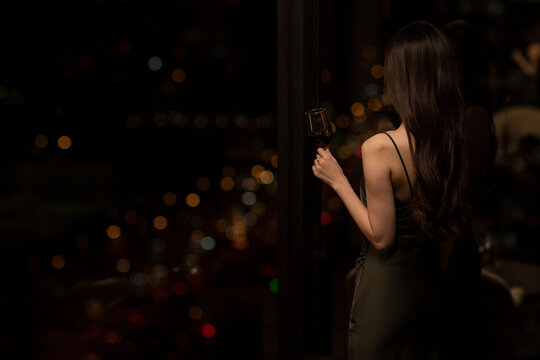 Young woman drinking red wine