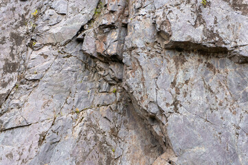 Background, texture rough stones of a stone cliff