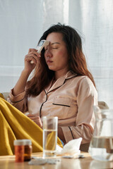 Woman Measuring Body Temperature