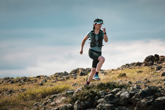 Female trail runner training in nature