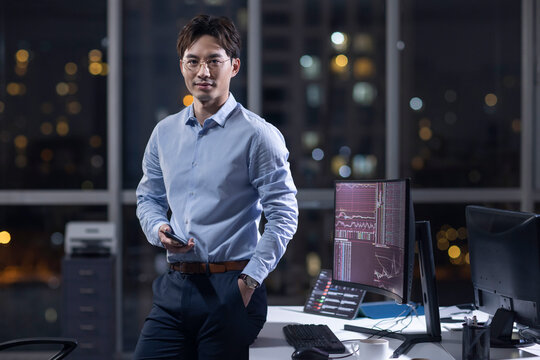 Businessman working in office at night