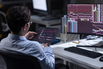 Businessman working in office at night