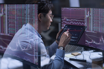 Businessman working in office at night