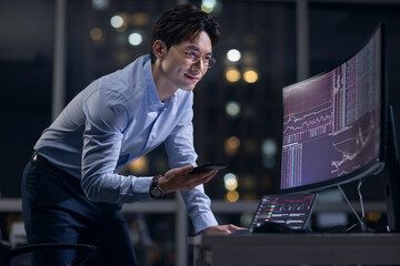 Businessman working in office at night