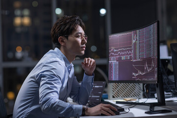 Businessman working in office at night