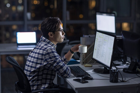 IT worker working in office at night