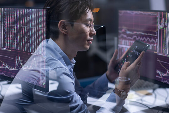 Businessman working in office at night