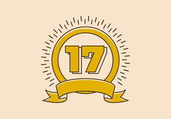 Vintage yellow circle badge with number 17 on it