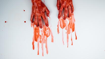 Female hands in blood on a white background. 