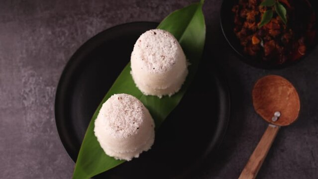 Rice Puttu white Pittu , Kadala Chickpea curry , milk tea , popular South Indian breakfast steamed rice cake Kerala food Tamil Nadu India Sri Lanka. rice flour grated coconut 4k video footage