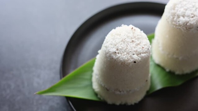 Rice Puttu white Pittu , Kadala Chickpea curry , milk tea , popular South Indian breakfast steamed rice cake Kerala food Tamil Nadu India Sri Lanka. rice flour grated coconut 4k video footage