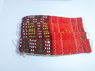 Close up isolated on white ulos masks to protect against viruses and air pollution for healthcare , environment and fashion industry. ulos is traditional cloth of north Sumatra