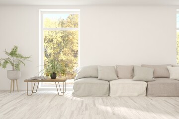 Fototapeta premium Stylish room in white color with sofa and autumn landscape in window. Scandinavian interior design. 3D illustration