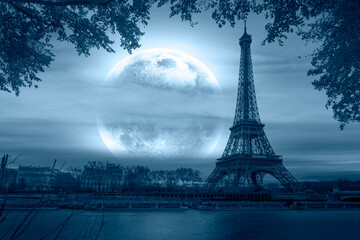 Paris Eiffel Tower and river Seine with full moon in Paris, France. Eiffel Tower is one of the most iconic landmarks of Paris "Elements of this Image Furnished by NASA"