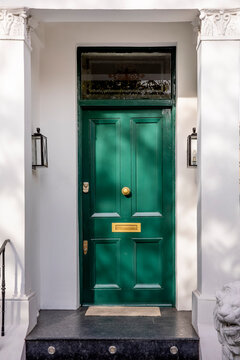 Green Front Door That Is Secured.