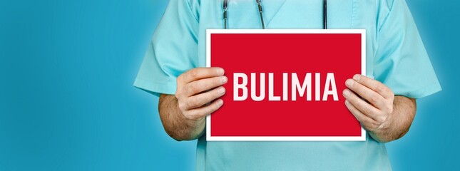 Bulimia nervosa. Doctor shows red sign with medical word on it. Blue background.