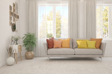 Fototapeta premium Stylish room in white color with sofa and autumn landscape in window. Scandinavian interior design. 3D illustration