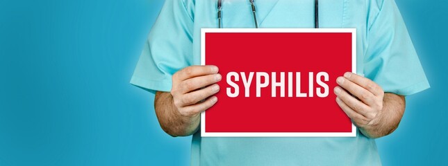 Syphilis. Doctor shows red sign with medical word on it. Blue background.