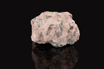 A raw shard of the mineral pegmatite. Light brown stone