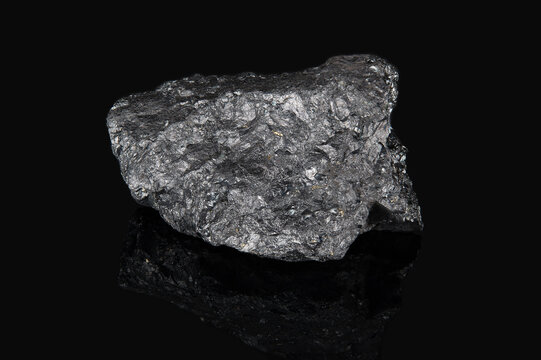 The mineral ilmenite is black in color with a metallic tint and with an uneven surface