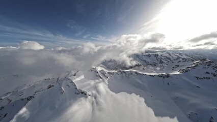 FPV sports drone raising shot winter mountain ridge with fog picturesque snowy summit valley frozen landscape. Aerial view natural cliff glacier fresh panorama epic scenery alpine frost exploration 4k - Powered by Adobe
