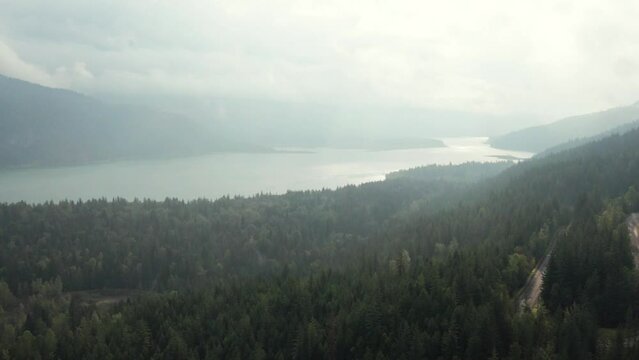 Establishing shot of Upper Arrow Lake with poor visibility due to the mist