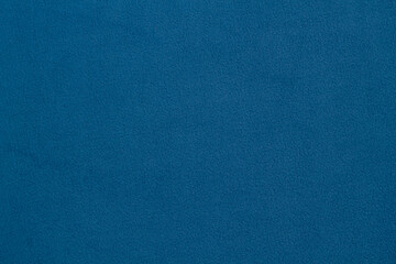 Fleece fabric blue top view. Texture of textile fleece bedspread.
