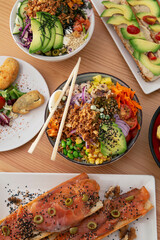Top view of some poke bowls on the table