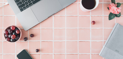 Modern working desk in the morning with tiles in background