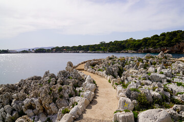 pedestrian path by mediterranean sea on the tourist coast  Juan-les-Pins in Antibes France