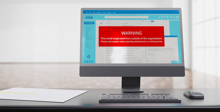 Email attachment warning message on a computer desktop screen. Cyber security concept.
