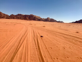 Fototapeta na wymiar Wadi Rum, Jordan, November 2019 - The desert is on the side of a dirt field
