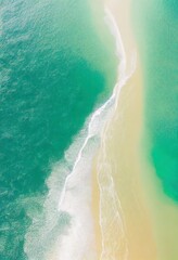 Beach with turquoise sea water. Top view of beautiful white sand.