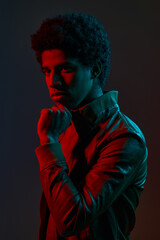 Portrait of young stylish man in neon red