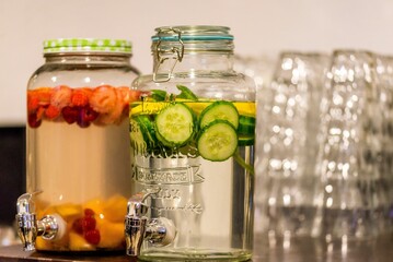 Selective focus of a gallon glass dispenser filled with lemonade