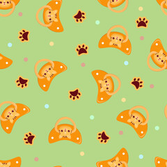 Seamless children's pattern on a green background. A dummy with a tiger. Pacifier for children.