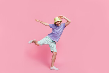 Full size photo of nice young cool man dancing beach pool party disco hip hop wear stylish blue outfit isolated on pink color background