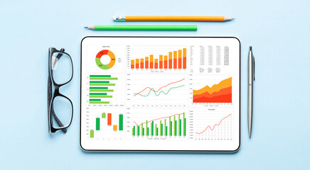 Tablet with business reports and charts