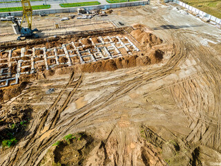 The initial stage of construction of a prefabricated reinforced concrete house. Foundation...